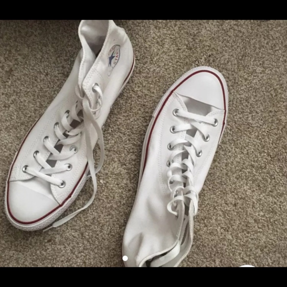 White high top chuck Taylor converse. All star.